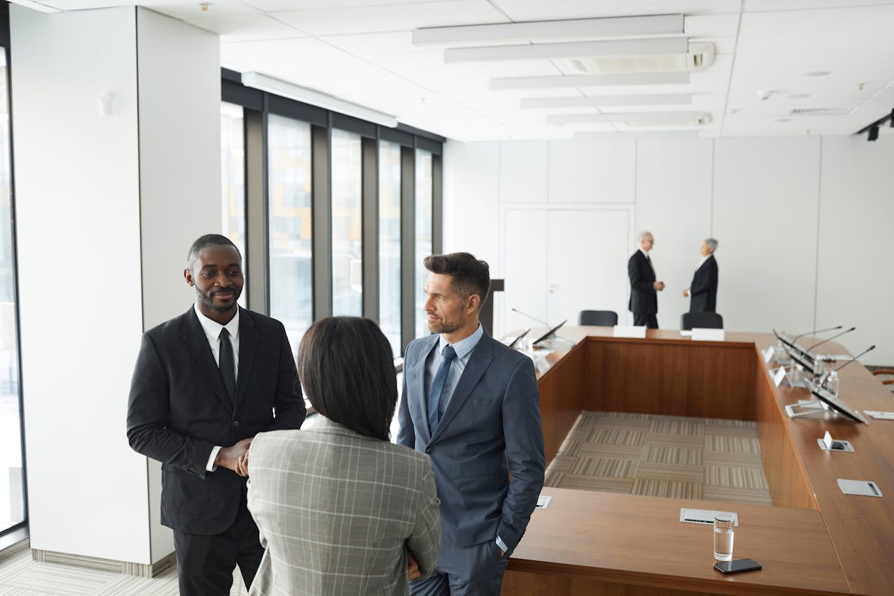 services-02 Business professionals engaging in a meeting in a modern conference room.